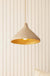 Close up of stone coloured sustainable pendant light with gold interior 